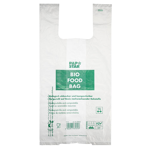 Die 100 Hemdchen-Tragetaschen der PAPSTAR GmbH sind transparente, biologisch abbaubare Bio-Folie-Knotenbeutel auf einer Rolle mit grünem „PAP STAR BIO FOOD BAG“-Text und mehrsprachigen Informationen zur Kompostierbarkeit und zu nachwachsenden Rohstoffen.
