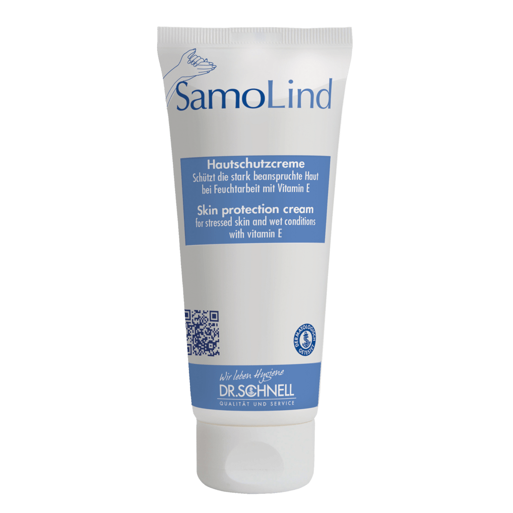 Un tubo bianco Dr. Schnell SAMOLIND protezione della pelle di DR.SCHNELL GmbH & Co. KGaA con accenti blu e testo in tedesco/inglese. La crema protegge la pelle stressata dall'umidità e contiene vitamina E.