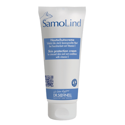 Un tubo bianco Dr. Schnell SAMOLIND protezione della pelle di DR.SCHNELL GmbH & Co. KGaA con accenti blu e testo in tedesco/inglese. La crema protegge la pelle stressata dall'umidità e contiene vitamina E.
