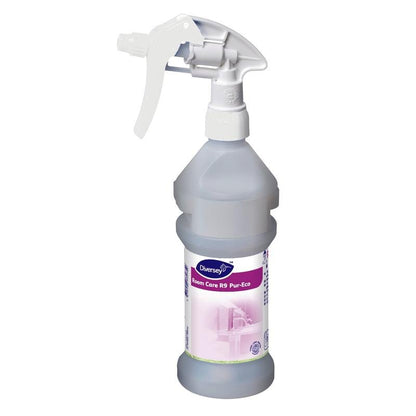 La bottiglia spray Room Care R9 Plus Pur-Eco, vuota, di Diversey Deutschland GmbH & Co. OHG, è dotata di un grilletto bianco e un'etichetta bianco-viola con pittogrammi di pulizia - ideale per la pulizia ecologica.
