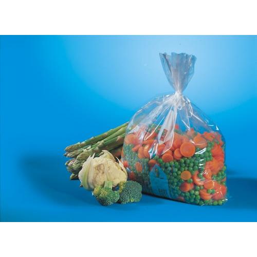Un sacchetto congelatore Starpak 100 trasparente (1 l, 24 cm x 16 cm) contiene verdure miste congelate ed è posizionato accanto ad asparagi freschi, cavolfiore e cimette di broccoli su sfondo blu.