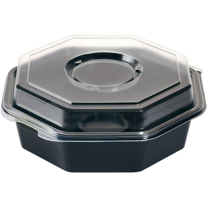 Il contenitore per alimenti Octaview® con vetro Nero / Trasparente PS della Duni GmbH è un contenitore di plastica ottagonale nero con coperchio trasparente, raffigurato inclinato su sfondo bianco.