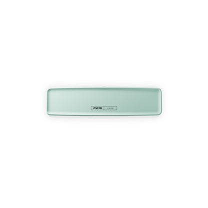Un dispositivo rettangolare di colore verde chiaro con angoli arrotondati e un'etichetta centrale con la scritta "CWS PureLine Frontpanel per PureLine Air Bar" è mostrato su uno sfondo bianco.