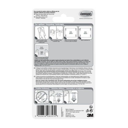 Rückseite einer Packung Command™ Poster-Strips 17024 von 3M Deutschland GmbH mit bebilderter Schritt-für-Schritt-Anleitung für rückstandsfreies Befestigen und Poster befestigen in mehreren Sprachen, mit Diagrammen, Barcode und 3M Branding unten rechts.