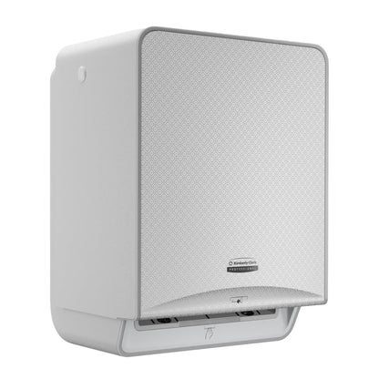 Il Kimberly-Clark Professional™ Icon™ Modulo Elettronico No Touch - Rotolo / Silver Mosaic di Kimberly-Clark GmbH è un distributore di asciugamani a parete senza contatto con una parte frontale a mosaico argentato strutturato e un'apertura inferiore per l'erogazione degli asciugamani.