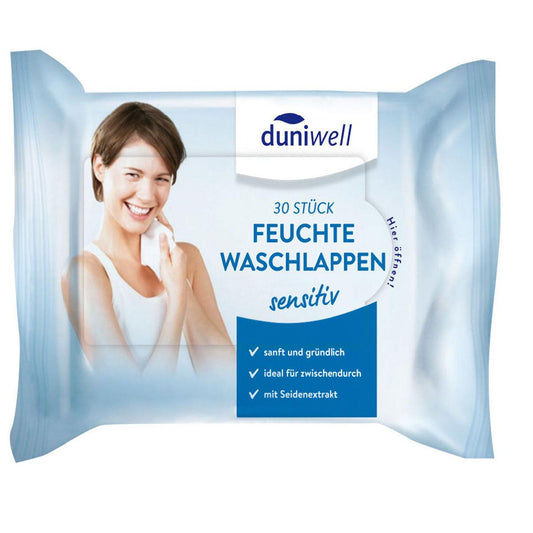 Eine Packung mit 30 Duni GmbH Feuchte Waschlappen, weiß - Ideal für die Hautpflege. Die Verpackung zeigt eine lächelnde Frau und deutsche Angaben zu Reinigung und Pflege, sanfte Anwendung, und Seiden-Extrakt.