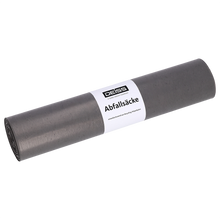 Eine aufgerollte graue DEISS 24022 Müllsäcke (700x1100 mm Typ 100, 15 Stück) der EMIL DEISS KG mit weißer Banderole in der Mitte steht auf einem schlichten weißen Hintergrund - ideal für die Schwerlastentsorgung.