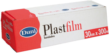 Una scatola rettangolare della Duni GmbH pellicola trasparente in PVC 300 m, etichettata con "30 cm x 300 m", mostra un design rosso-bianco con logo blu. La scatola non aperta mantiene freschi gli alimenti e mostra "Tuorekelmu" sotto il nome del prodotto.