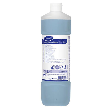 Una bottiglia da 1 litro di detergente deodorante TASKI Sprint Flower di Diversey Deutschland GmbH & Co. OHG contiene un liquido blu, un tappo bianco e un'etichetta con informazioni sul prodotto, istruzioni e simboli di sicurezza.