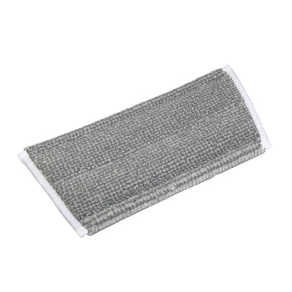Il TASKI Jonmaster Pro HD Scheuermopp della Diversey Deutschland GmbH & Co. OHG è un pad in microfibra rettangolare grigio con bordo bianco, ideale per compiti di pulizia professionale.