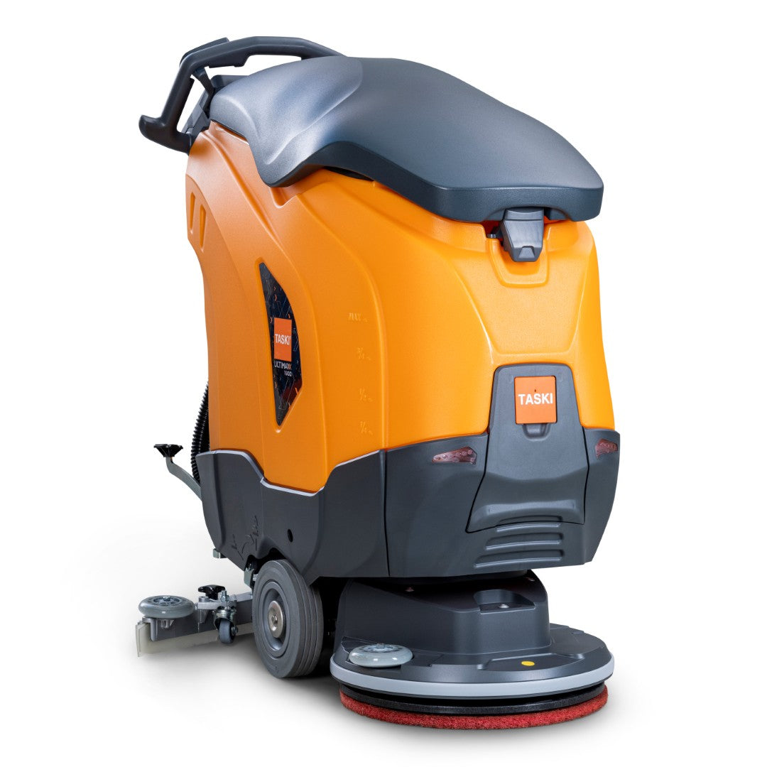 La TASKI ULTIMAXX 1900 SD43 Economy BMS 25A di Diversey Deutschland è una nuova lavasciuga pavimenti senza motore con un telaio arancione-grigio, serbatoio da 42L, maniglia, ruote e disco singolo visibile da 43 cm sul pavimento.