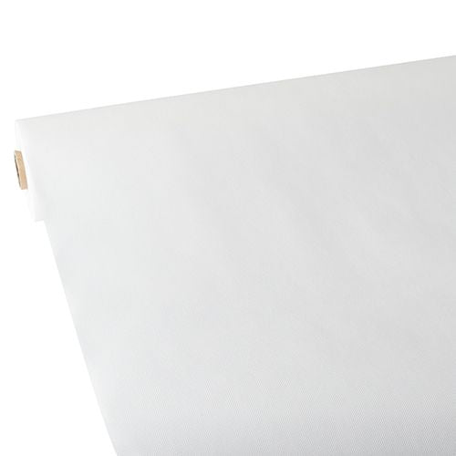 Un grande rotolo di tovaglia Starpak, simile al tessuto, in tessuto non tessuto "Soft Selection" (25 m x 1,18 m, bianco) è disteso su una superficie piana, con la superficie liscia visibile sul bordo rivolto verso l'alto. Il rotolo Starpak è visibile in diagonale da un angolo.