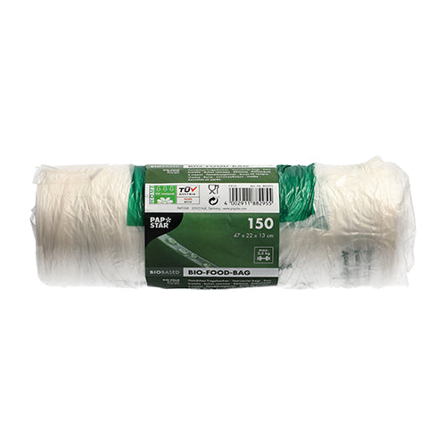 Un rotolo con 150 PAPSTAR sacchetti a nodo (47x22 cm) in pellicola bio trasparente della PAPSTAR GmbH mostra una fascetta verde-bianca con informazioni sul prodotto e simboli, non utilizzato su sfondo bianco.