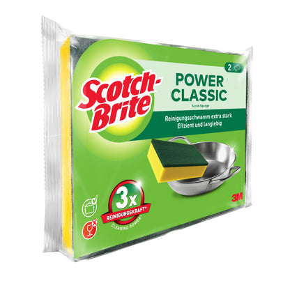 Abgebildet ist eine Verpackung der 3M Deutschland GmbH Scotch-Brite® Classic Reinigungsschwamm mit zwei Schwämmen. Auf der überwiegend grünen Verpackung sind ein Schwamm und ein Metalltopf abgebildet, dazu englischer und deutscher Text.