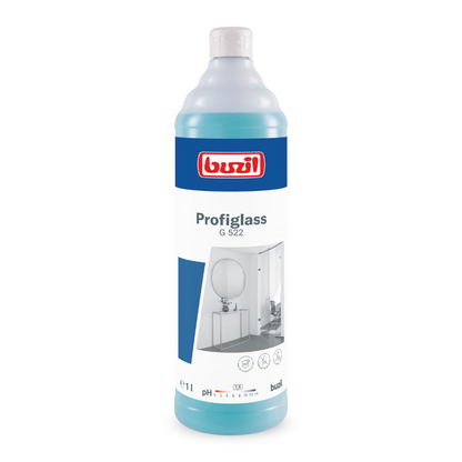 Una bottiglia da 1 litro di Buzil Profiglass G 522 detergente per vetri e superfici pronto all'uso garantisce una lucentezza senza striature. La bottiglia trasparente con il liquido blu è dotata di un'etichetta bianca su cui sono visibili il logo del marchio BUZIL-WERK Wagner GmbH & Co. KG, il nome del prodotto e le immagini di uno specchio da bagno e di un lavandino. È quindi perfetta per combattere i residui grassi.
