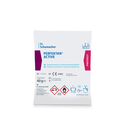 Questa è un'immagine di un pacchetto bianco con la scritta "Dr. Schumacher Perfektan® Active Instrumentendesinfektion" della Dr. Schumacher GmbH. La confezione indica che si tratta di un concentrato in polvere di acido peracetico per la disinfezione degli strumenti. Contiene 40 grammi ed è dotato di simboli di pericolo, istruzioni per l'uso e marchi di controllo.