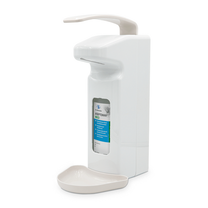 Il distributore a parete Dr. Schumacher SPE 500 della Dr. Schumacher GmbH è un distributore automatico di disinfettante bianco con una vaschetta grigia per il gocciolamento nella parte inferiore. Questo dispositivo contiene una bottiglia visibile da 500 ml di disinfettante per le mani con la scritta "ASEPTOMAN MED" e dispone di un sensore curvo sulla parte superiore per l'uso senza contatto.