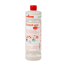 Una bottiglia di plastica da 1 litro Johannes Kiehl KG Kiehl Duocit-eco balance detergente sanitario senza profumi e coloranti con tappo rosso ed etichetta bianca con informazioni sul prodotto rosse e nere, simboli e istruzioni per l'uso.