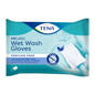 L'imballaggio dei TENA ProSkin Wet Wash Gloves, guanti da lavaggio senza profumo | Confezione (8 pezzi) sottolinea la loro idoneità per un'igiene personale comoda. I guanti sono delicati sulla pelle sensibile e non devono essere risciacquati. Un'immagine per la dimostrazione dell'applicazione si trova sul retro della confezione blu.