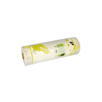 Un runner da tavola della collezione ROYAL della PAPSTAR GmbH presenta un motivo floreale in giallo e verde su sfondo bianco. L'etichetta è composta da un mix di PV-Tissue e contiene testo e dettagli del prodotto. Il rotolo è leggermente inclinato a sinistra.