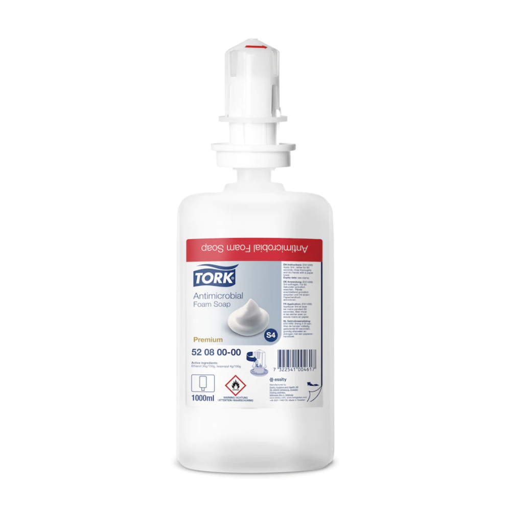 Un flacone di sapone in schiuma Tork 520800 da 1000 ml per la decontaminazione delle mani Premium S4 di TORK - Essity Professional Hygiene Germany GmbH, con testa del dosatore bianca ed etichetta rossa. Certificato EN 1499, ideale per una decontaminazione efficace delle mani.