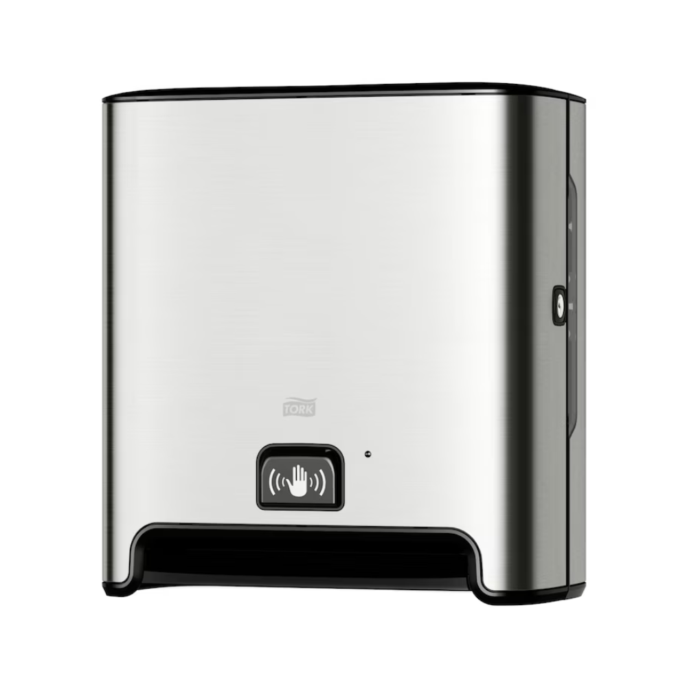 Un TORK Tork Matic® 460001 distributore automatico per asciugamani a rotolo Image Line in acciaio inox per montaggio a parete con sensore H1 | Confezione (1 pezzo) con base nera e simbolo dell'indicatore del sensore sulla parte anteriore. Questo distributore, progettato per l'erogazione senza contatto di fogli singoli, presenta un aspetto moderno e semplice e utilizza asciugamani a rotolo per garantire un'esperienza igienica.