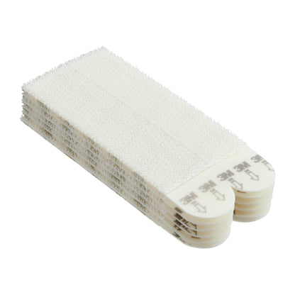 Ein Stapel 3M Command™ Bilder-Montage Strips L (6 Sets, Vorteilspack, 17206-6), rechteckig, weiß mit abgerundeten Enden und Zuglasche mit Pfeildruck und Anleitung, von der Seite gezeigt. Marke: 3M Deutschland GmbH.