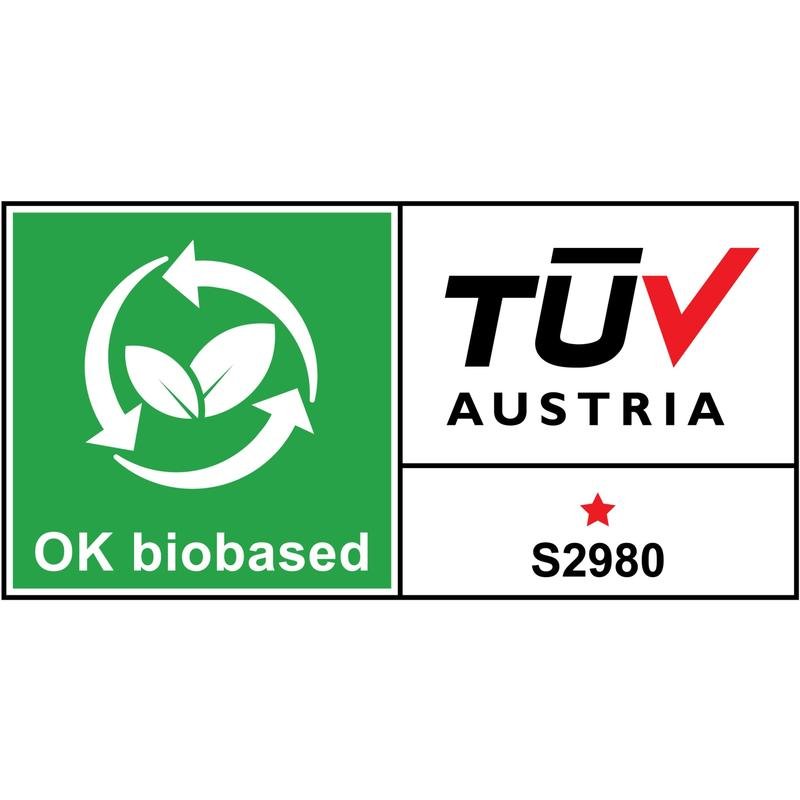 Il dispenser da tavolo Scotch™ Karim Rashid di 3M Deutschland GmbH presenta un'etichetta di certificazione con un'area verde con simbolo di riciclaggio e foglie con la scritta "OK biobased" e un'area bianca con "TÜV AUSTRIA", una stella rossa e "S2980".