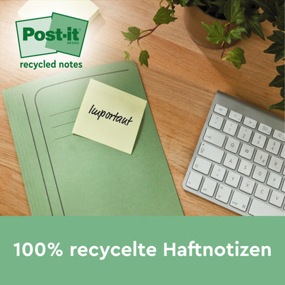 Ein grüner Ordner mit einem Post-it® Recycling Z-Zettel der 3M Deutschland GmbH mit der Aufschrift "Wichtig" liegt auf einem Holzschreibtisch neben einer weißen Tastatur und einer grünen Pflanze. Text darunter: "100% PEFC umweltfreundliche Notizen, 76x76mm, 100 Blatt/Block, 6 Blöcke/Packung.
