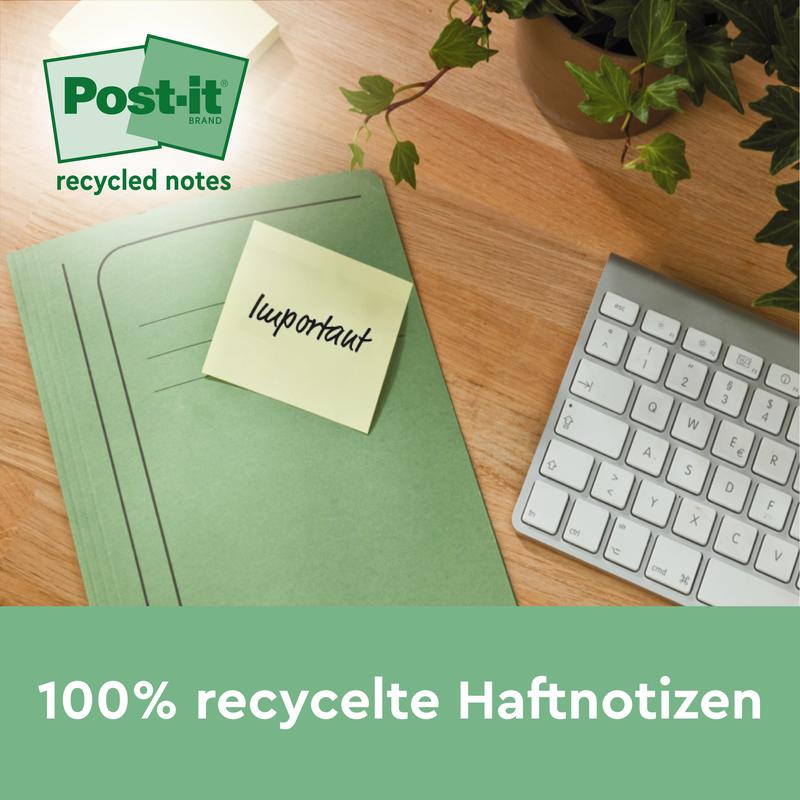 Una cartella verde con un foglietto adesivo Post-it® Recycling Z della 3M Deutschland GmbH con la scritta "importante" si trova su un tavolo di legno accanto a una tastiera e una pianta. Il testo sottostante recita: "Foglietti adesivi riciclati al 100%, 76x76mm, 100 fogli/blocco, 100% PEFC.