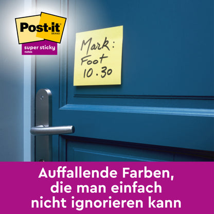 Ein gelber Post-it® Super Sticky Note (76 mm x 76 mm, 3M Deutschland GmbH) mit der handschriftlichen Aufschrift "Mark: Foot 10.30" ist oberhalb des Griffs an einer blauen Tür angebracht, das Logo und der deutsche Text sind am unteren Rand des Bildes sichtbar.